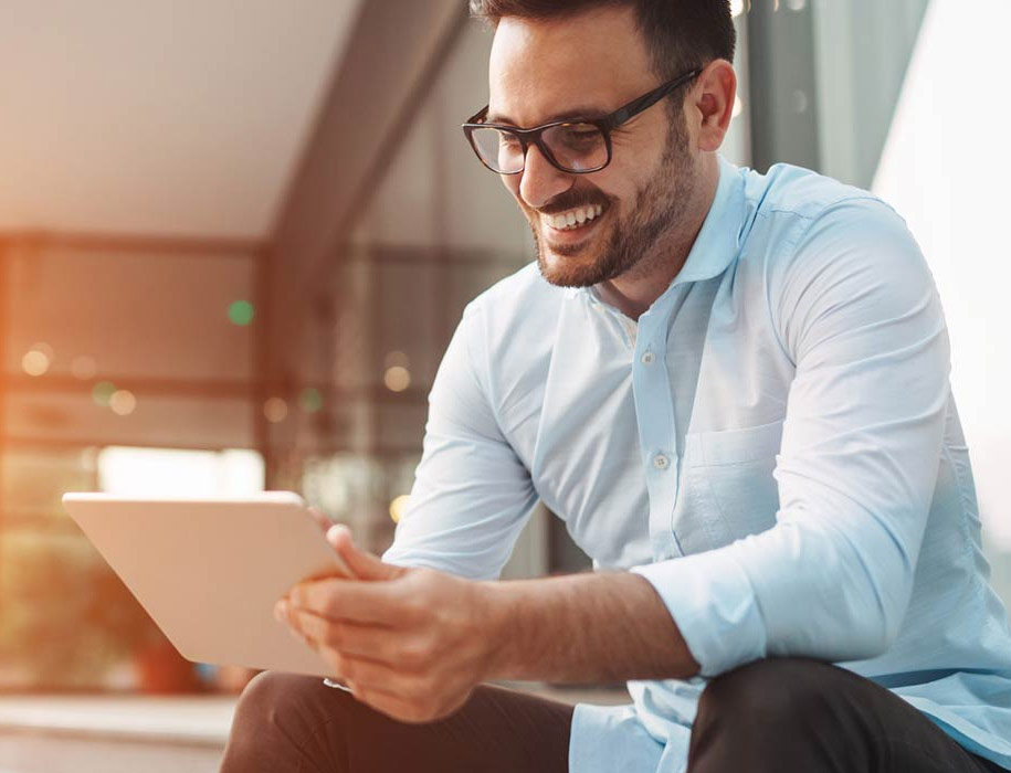 man looking at tablet